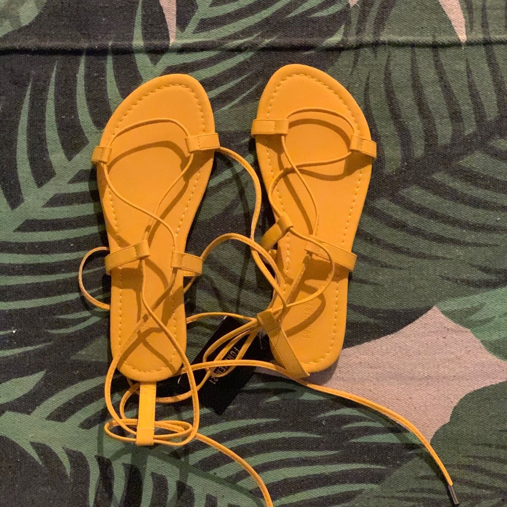 Lace up sandals.